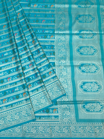Teal Blue Banarasi Silk Saree with Warli-Inspired Folk Art