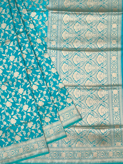 Exquisite Teal Banarasi Silk Saree with Floral Jaal & Silver Zari