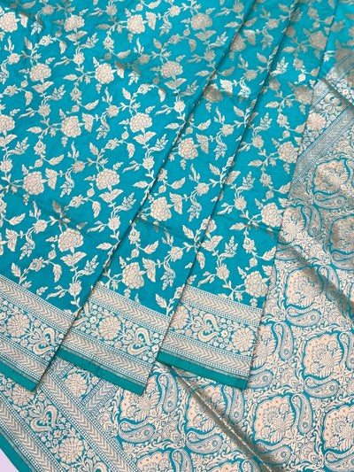 Exquisite Teal Banarasi Silk Saree with Floral Jaal & Silver Zari