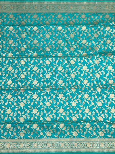 Exquisite Teal Banarasi Silk Saree with Floral Jaal & Silver Zari