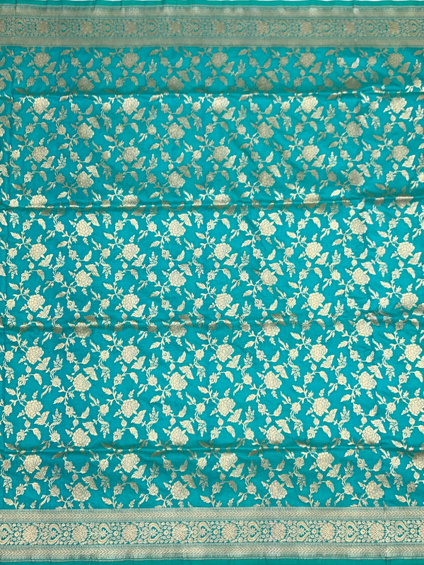 Exquisite Teal Banarasi Silk Saree with Floral Jaal & Silver Zari