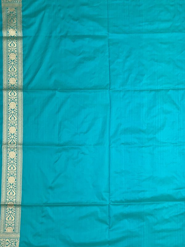 Exquisite Teal Banarasi Silk Saree with Floral Jaal & Silver Zari