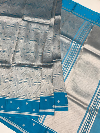 Exquisite Silver Brocade Silk Kora Saree with Cerulean Blue Border