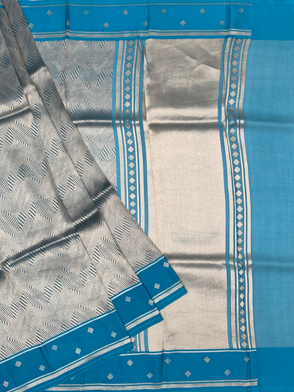 Exquisite Silver Brocade Silk Kora Saree with Cerulean Blue Border