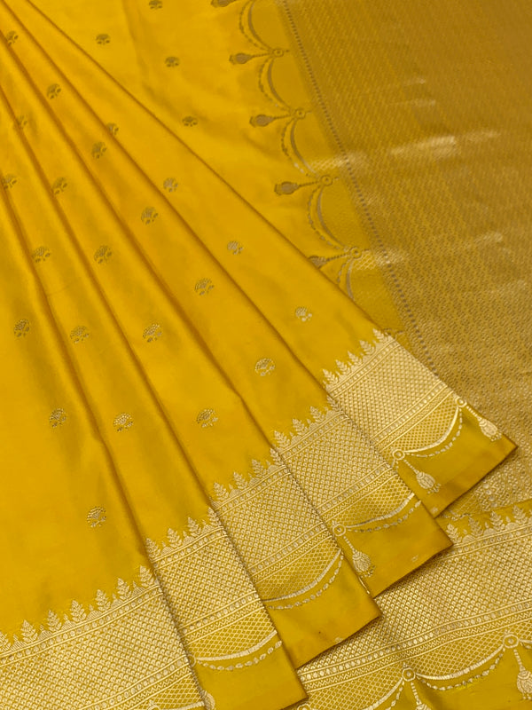 Sunflower Yellow Mashru Silk Saree with Scalloped Tassel Border