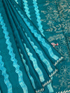 Deep Teal Tussore Silk Saree with Botanical Threadwork & Wavy Accents
